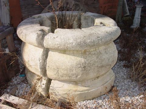 EARLY FRENCH STONE FOUR-PIECE WELLHEAD