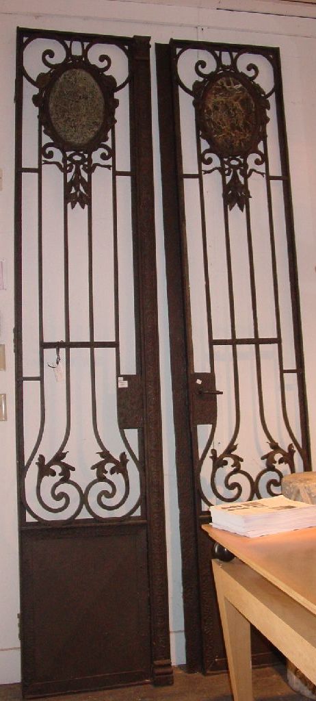 PAIR OF FRENCH MARBLE INSET IRON