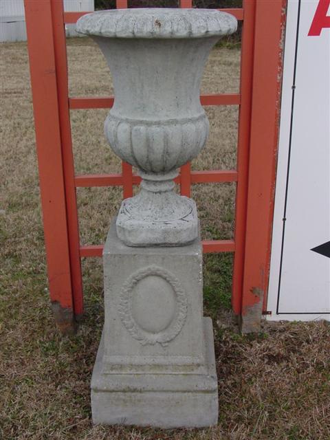 TWO CAST STONE URNS ON STANDS h:51 w:17 d:17 in.