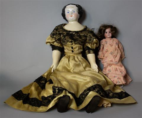 TWO DOLLS INCLUDING A LARGE CHINA