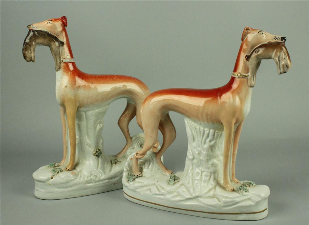 TWO STAFFORDSHIRE MODELS OF GREYHOUNDS 145a1f