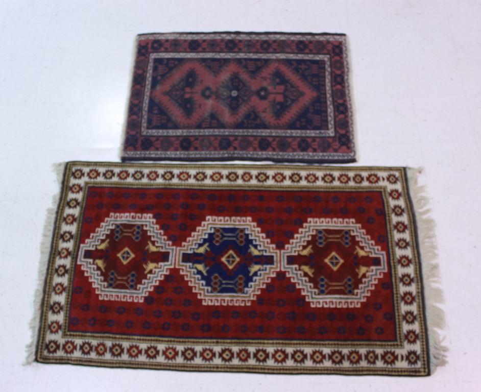 TWO CAUCASUS RUGS the larger in