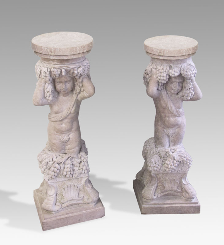 PAIR OF CARVED PINK MARBLE PUTTI