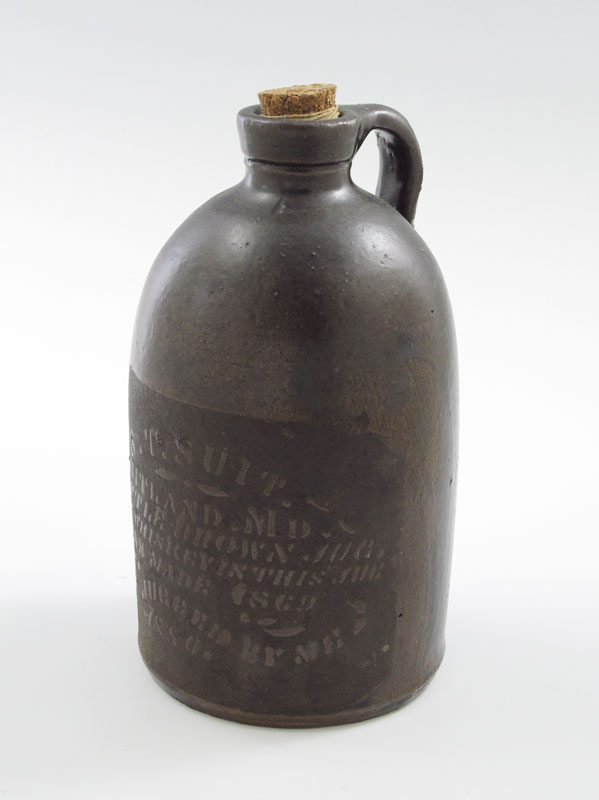 S. T. SUIT LITTLE BROWN WHISKEY JUG