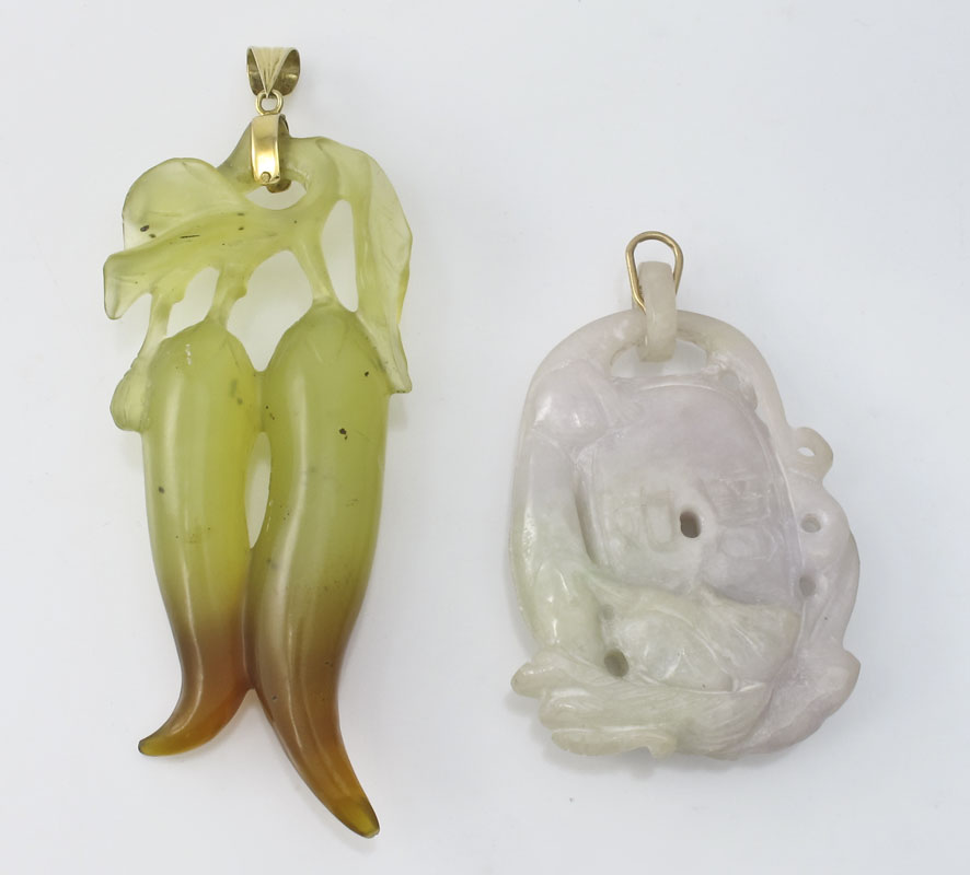 2 CARVED STONE PENDANTS: Possibly