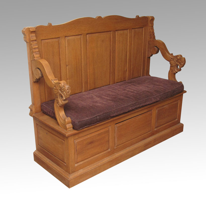 GOLDEN OAK BENCH WITH CARVED LION ARMS: