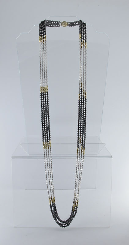 A 38'' BEAD NECKLACE OF 14K GOLD