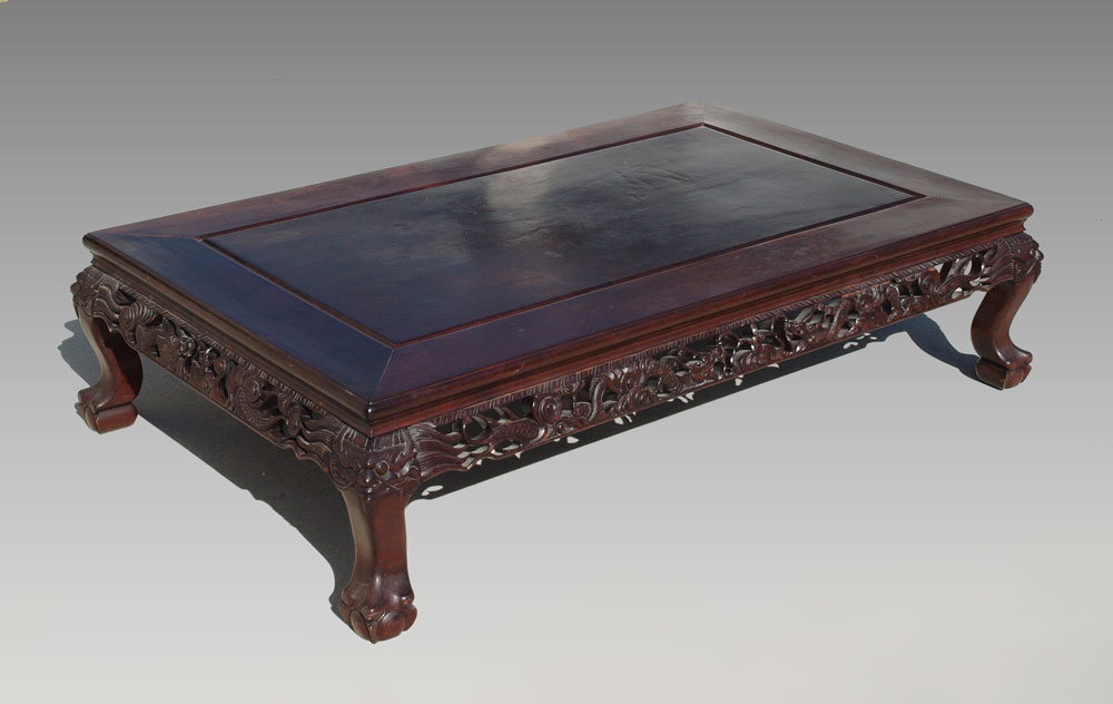 A LOW INDONESIAN CARVED MAHOGANY 149643