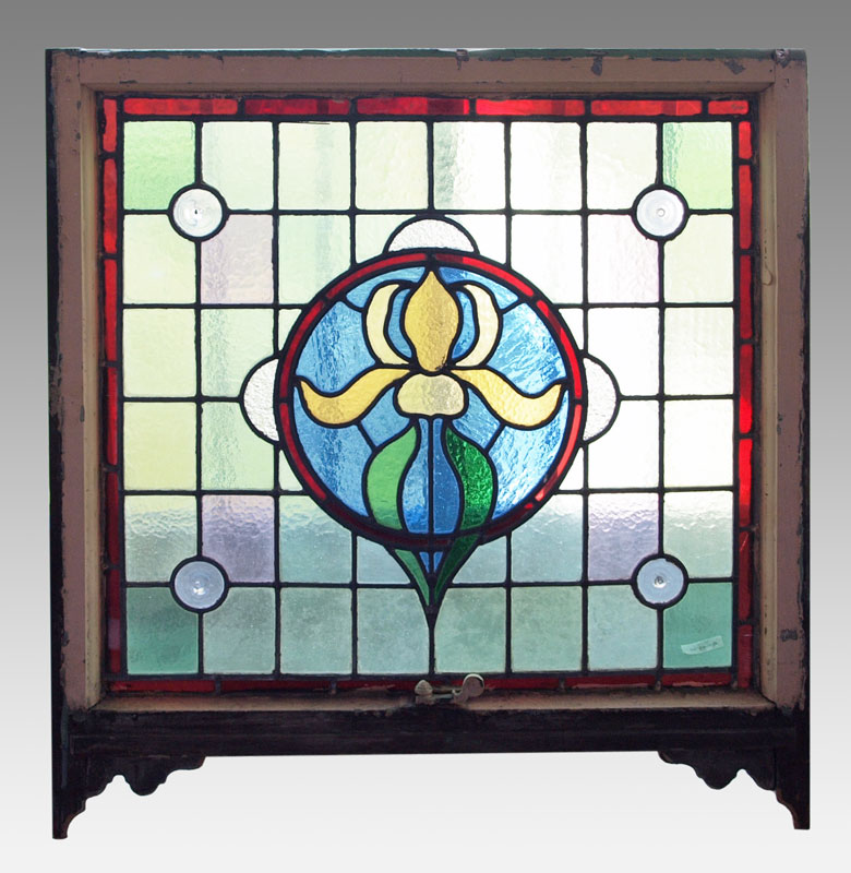 STAINED GLASS WINDOW FRAMED IN