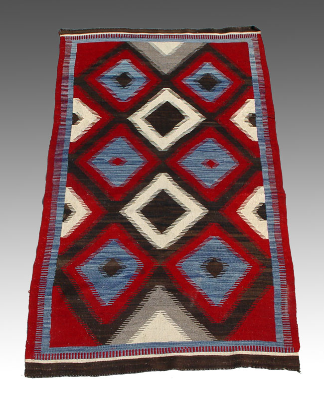 NAVAJO RUG: Vibrant red blue and brown
