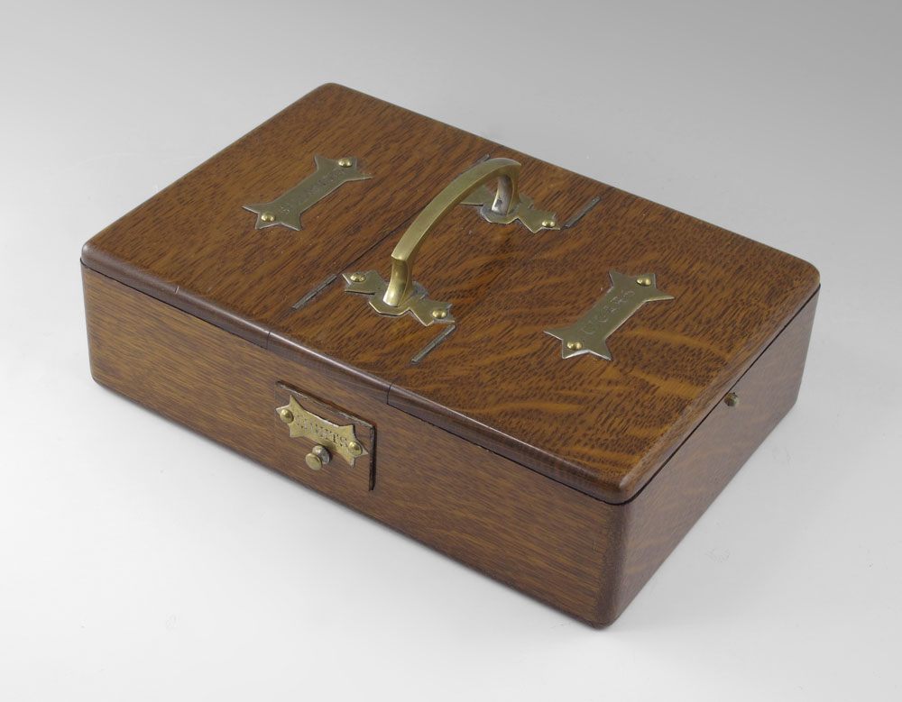 1885 FINE OAK AND BRASS SMOKING BOX: