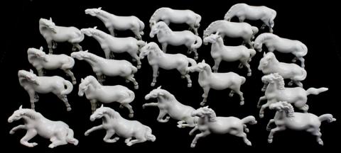 TWENTY-TWO WHITE PORCELAIN HORSES in