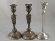 A pair of silver candlesticks London