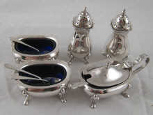 A five piece silver condiment set comprising