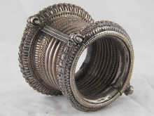 A white metal (tests silver) bangle