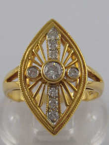 An 18 carat gold and diamond ring of