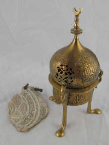 An Islamic brass incense burner together