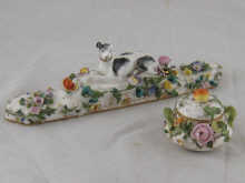 A miniature bowl and cover encrusted