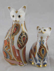 Two Royal Worcester figures of a cat