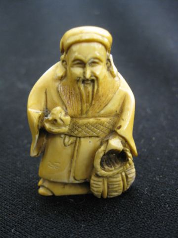 Carved Ivory Netsuke of an Old Man with