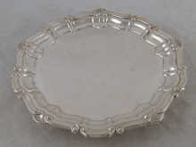 A silver salver with shell and 14b239
