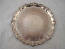 A silver waiter with shaped and