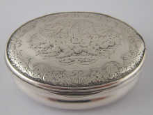 A white metal (tests silver) oval snuff