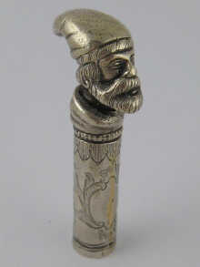 A silver plated brass cane handle