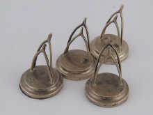 A set of four wishbone shaped silver