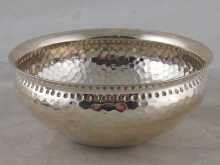 A silver bowl with hammered finish