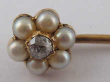 A diamond and pearl set gold stick