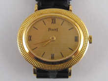 An 18 carat gold wrist watch by 14b2dd