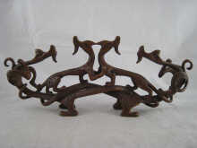 A bronze of four intertwined dragons