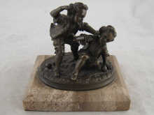 A bronze group of two boys fighting