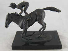 A bronze group of a racehorse with 14b2fd