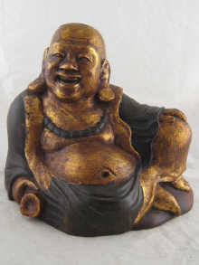 A sitting wooden Buddha gilded and painted