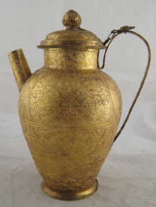 A Chinese gilt metal jug and cover