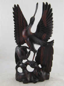 A Balinese rosewood carving of birds