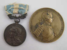 A bronze medal the obverse Frederic