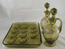 A green glass liqueur set comprising