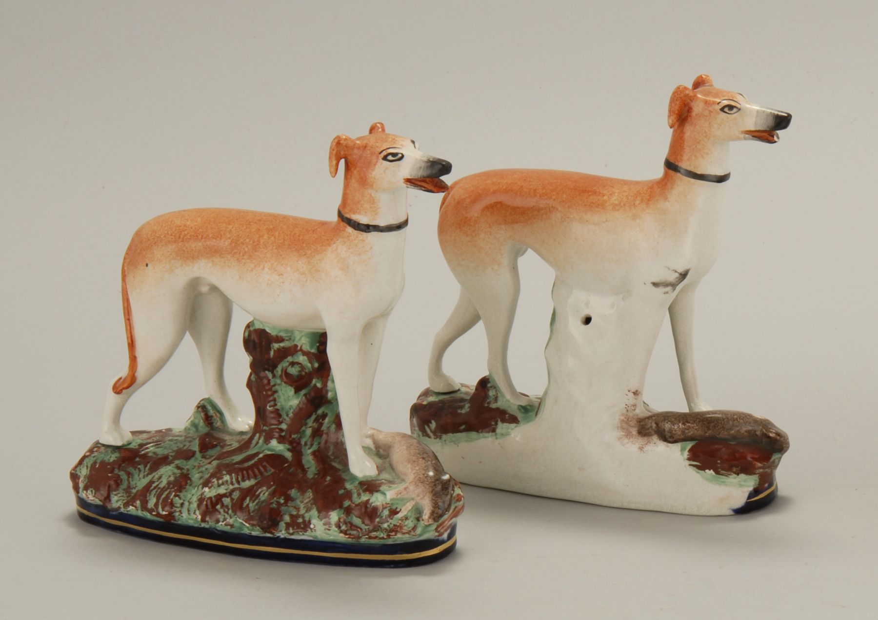 PAIR OF ANTIQUE STAFFORDSHIRE WHIPPET-FORM