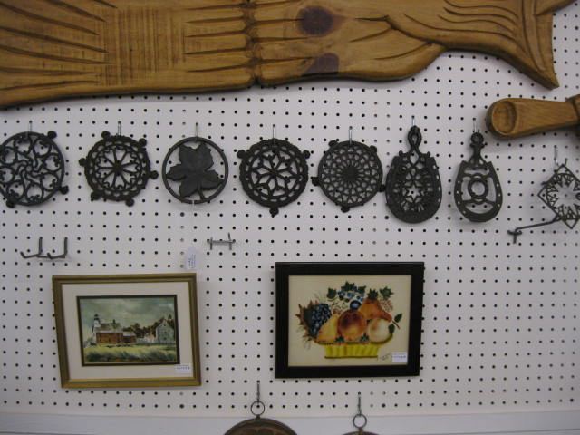 8 Cast Iron Trivets some signed
