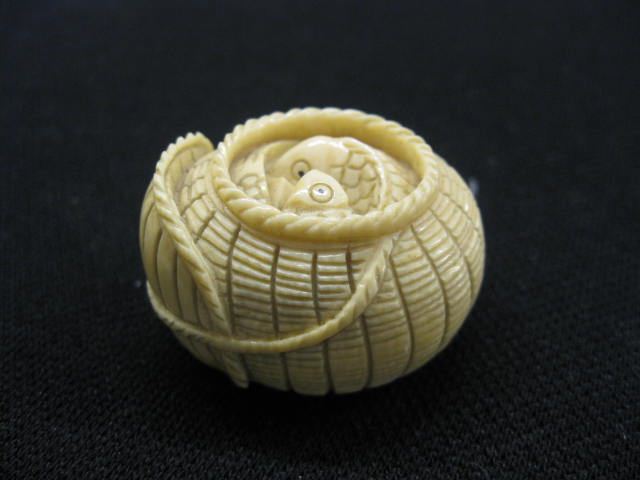 Carved Ivory Netsuke fish in basket