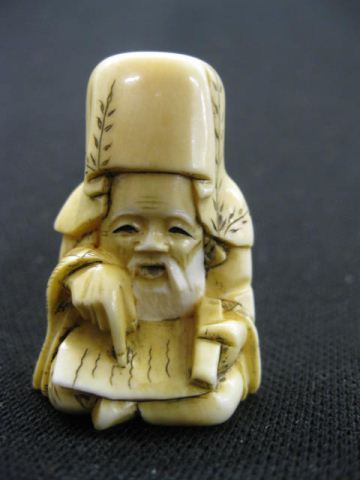 Carved Ivory Netsuke of a Scholar