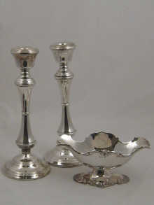 A pair of silver candlesticks hallmarked 14bbef