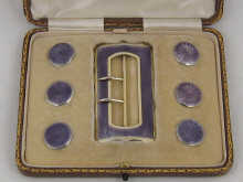 A silver gilt and enamel belt buckle