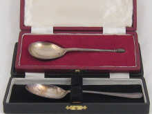 A modern silver christening spoon in