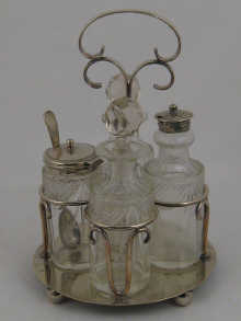 A four bottle silver plated cruet  14bc25
