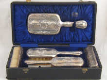 A five piece boxed silver dressing 14bc23