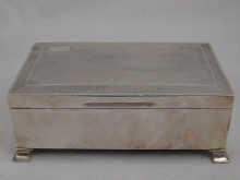 A silver cigarette box on feet 14bc2b